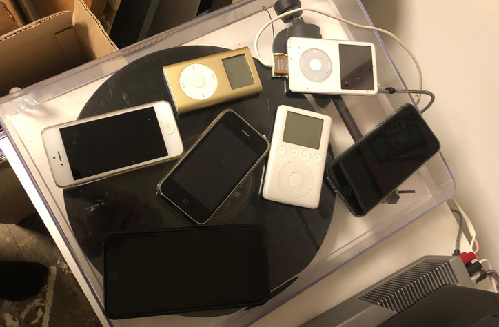 The collection of old iPods and disused iPhones that Smith uses to collect his music